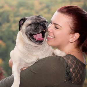 Portrait of Petra Romano with her pug, Pugo